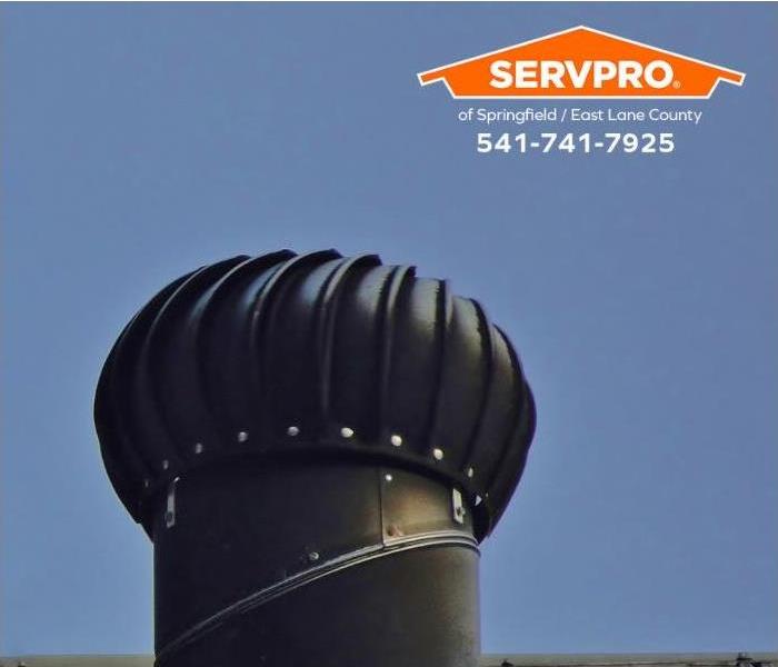 A turbine vent is shown on the roof of a home.
