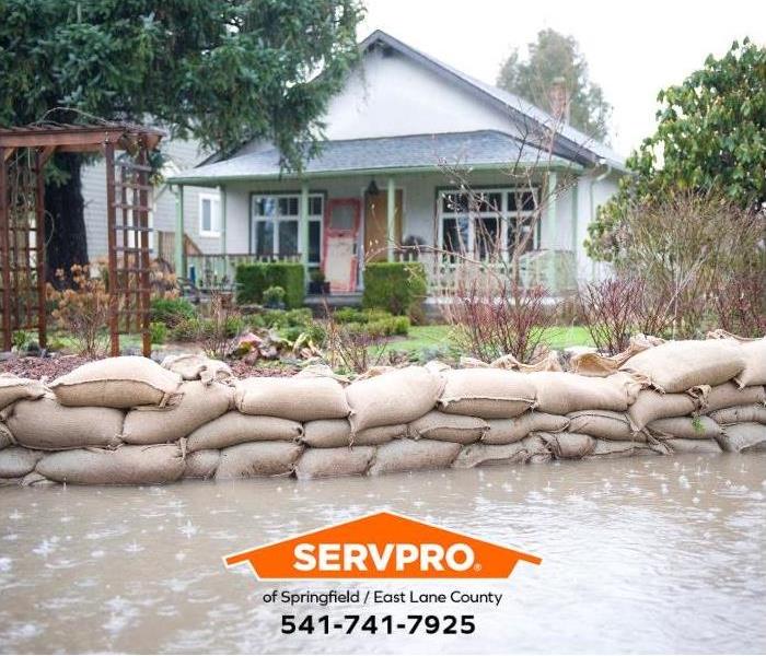 Sandbags protect the exterior of a home against flooding.
