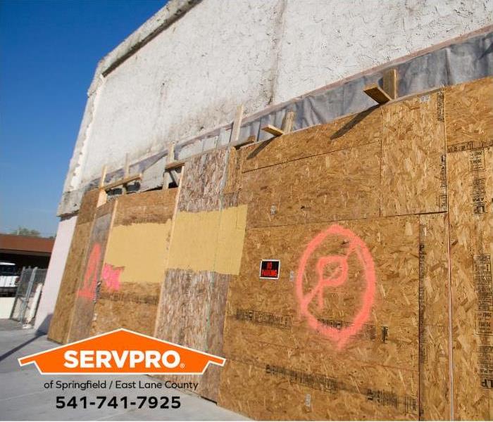 A building damaged in an accident is boarded up.